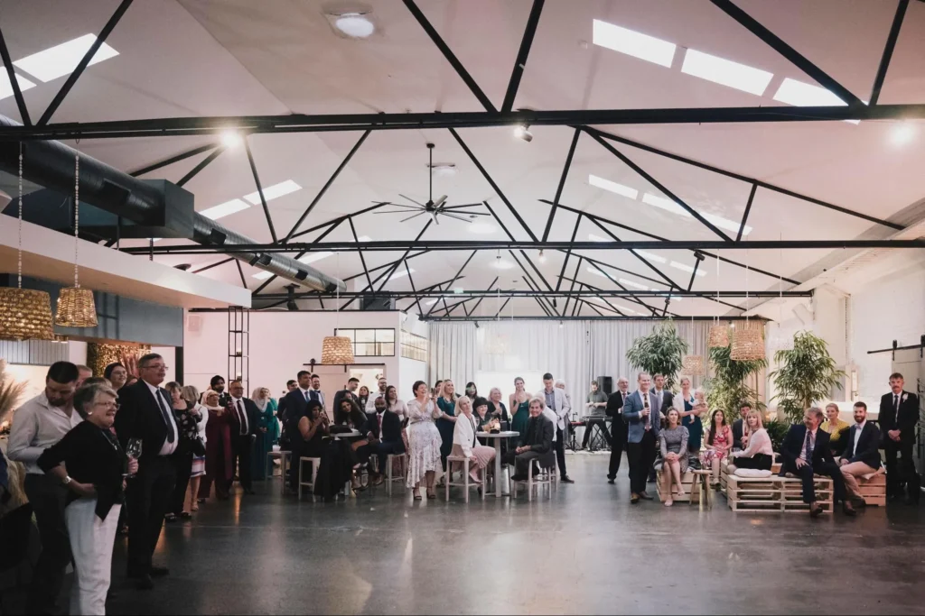 A formal team-building gathering in a modern workplace setting, focusing on the importance of team building for fostering collaboration and communication.