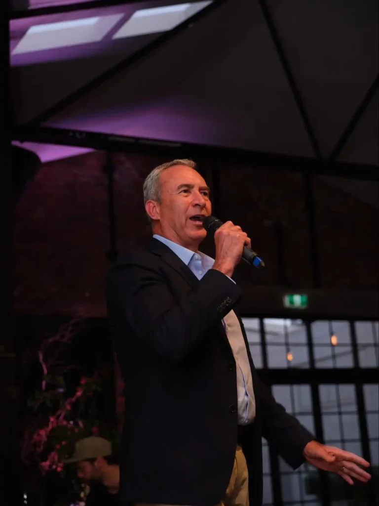 Speaker addressing the audience at a corporate dinner in Melbourne