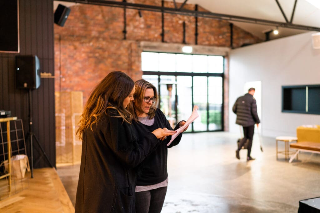 Two ladies having discussions about event planning at the event venue